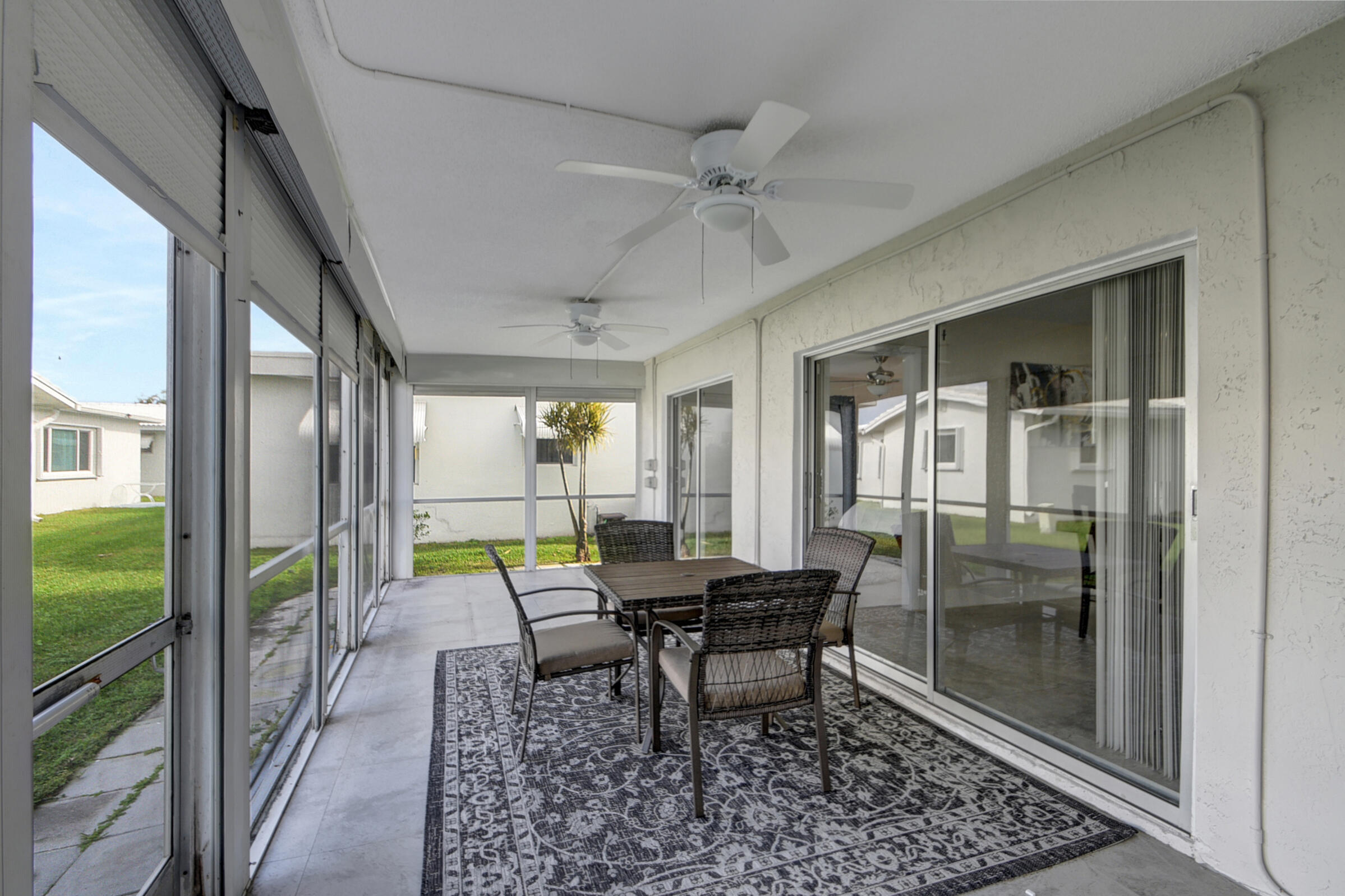 716 Southwest 18th Street Boynton Beach, FL 33426 - Photo 49 of 65 a view of a dining room with furniture window and wooden floor