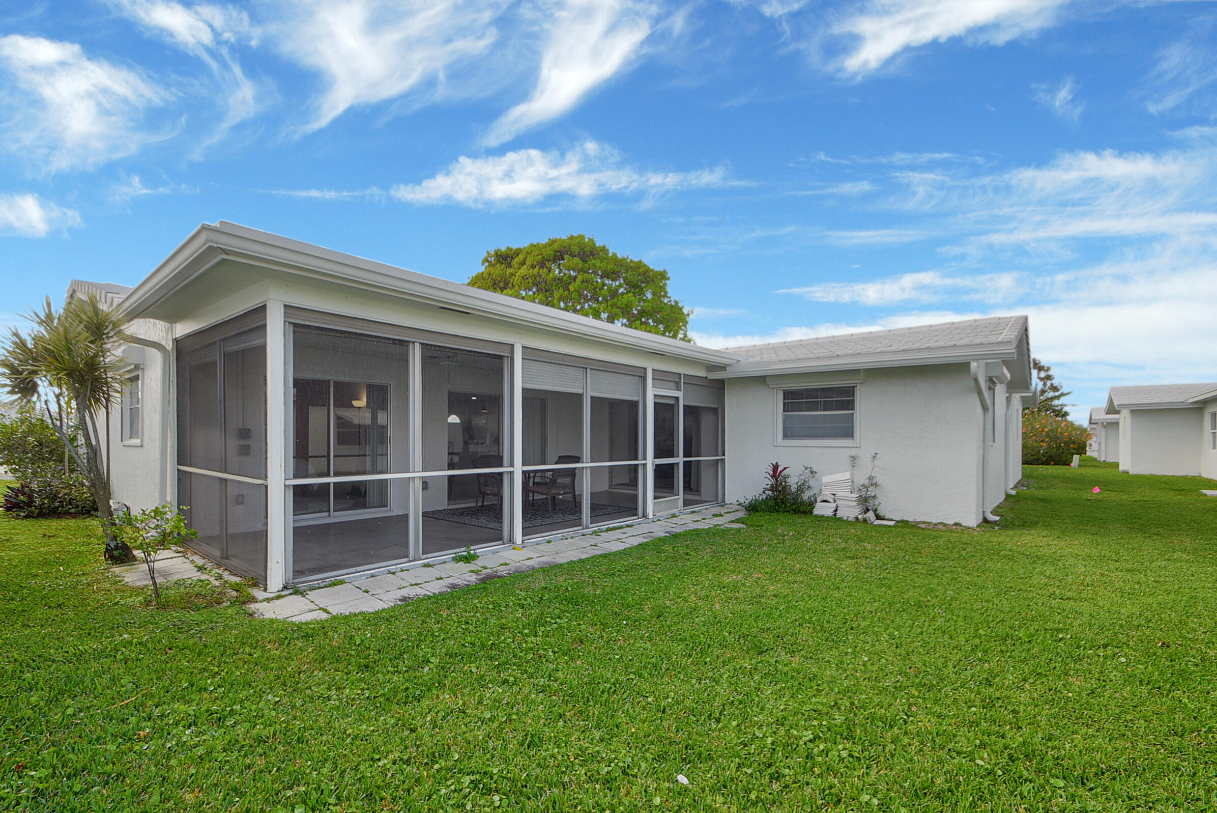 716 Southwest 18th Street Boynton Beach, FL 33426 - Photo 57 of 65 a view of a house with a yard