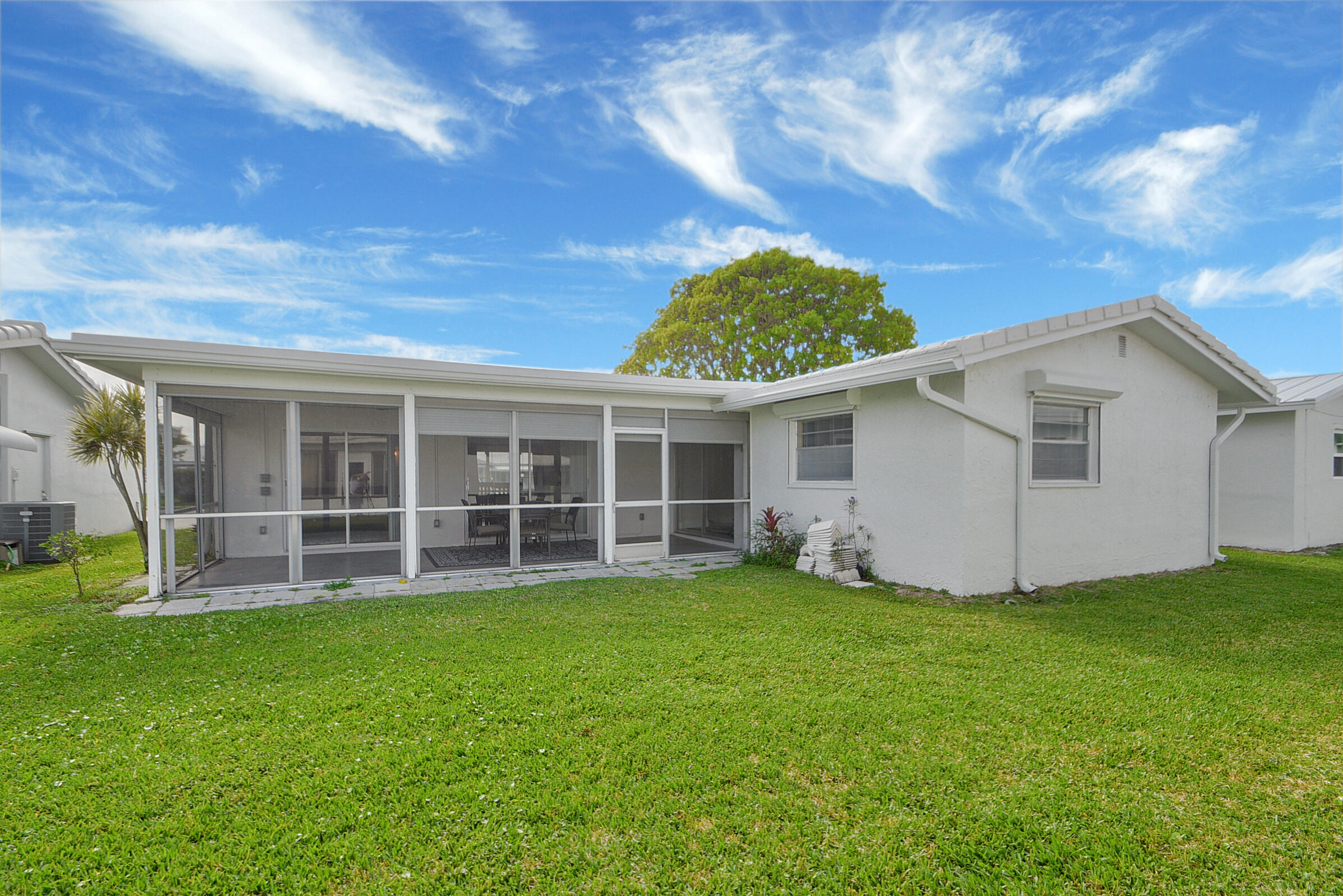 716 Southwest 18th Street Boynton Beach, FL 33426 - Photo 58 of 65 a view of a house with a yard