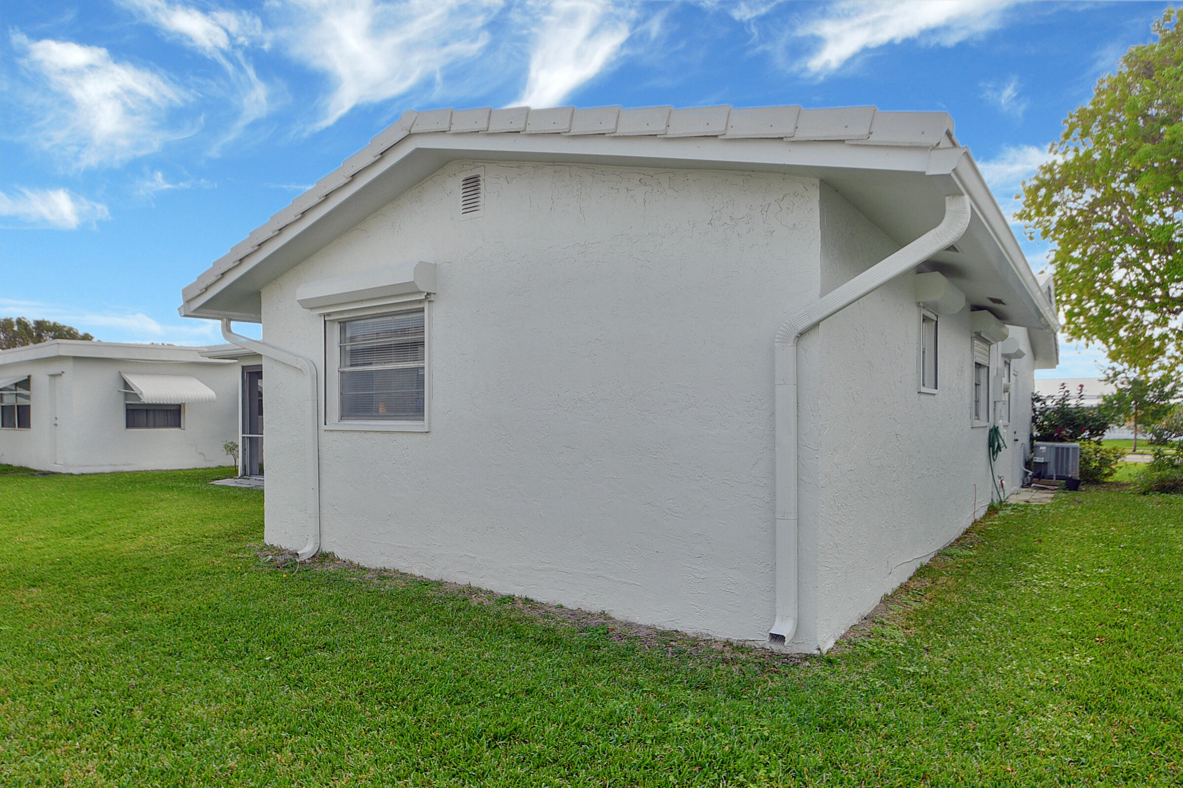 716 Southwest 18th Street Boynton Beach, FL 33426 - Photo 59 of 65 a view of backyard of house with green space