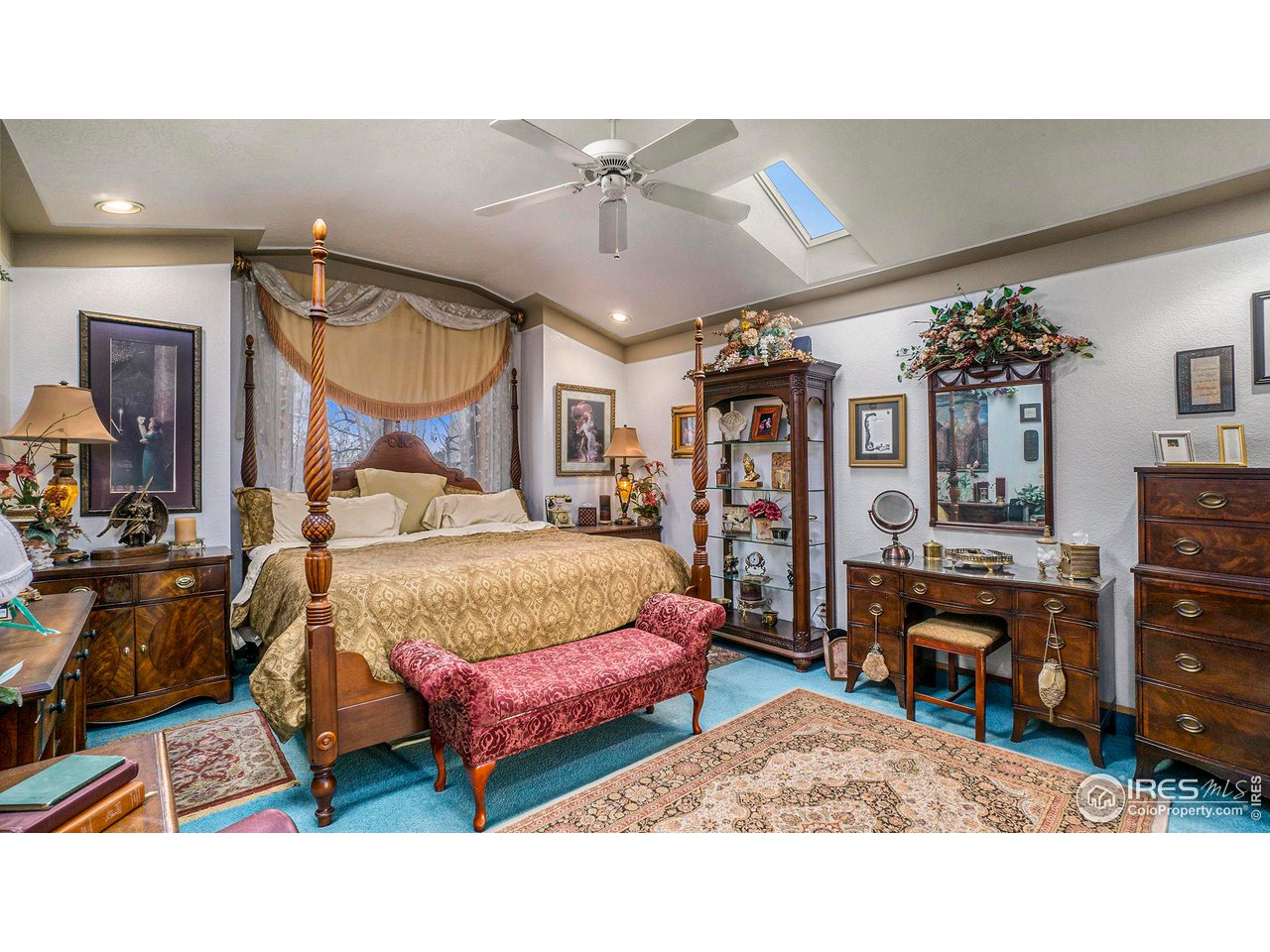 4328 West 14th Street Road Greeley, CO 80634 - Photo 14 of 30 a bedroom with a bed a dresser and potted plants