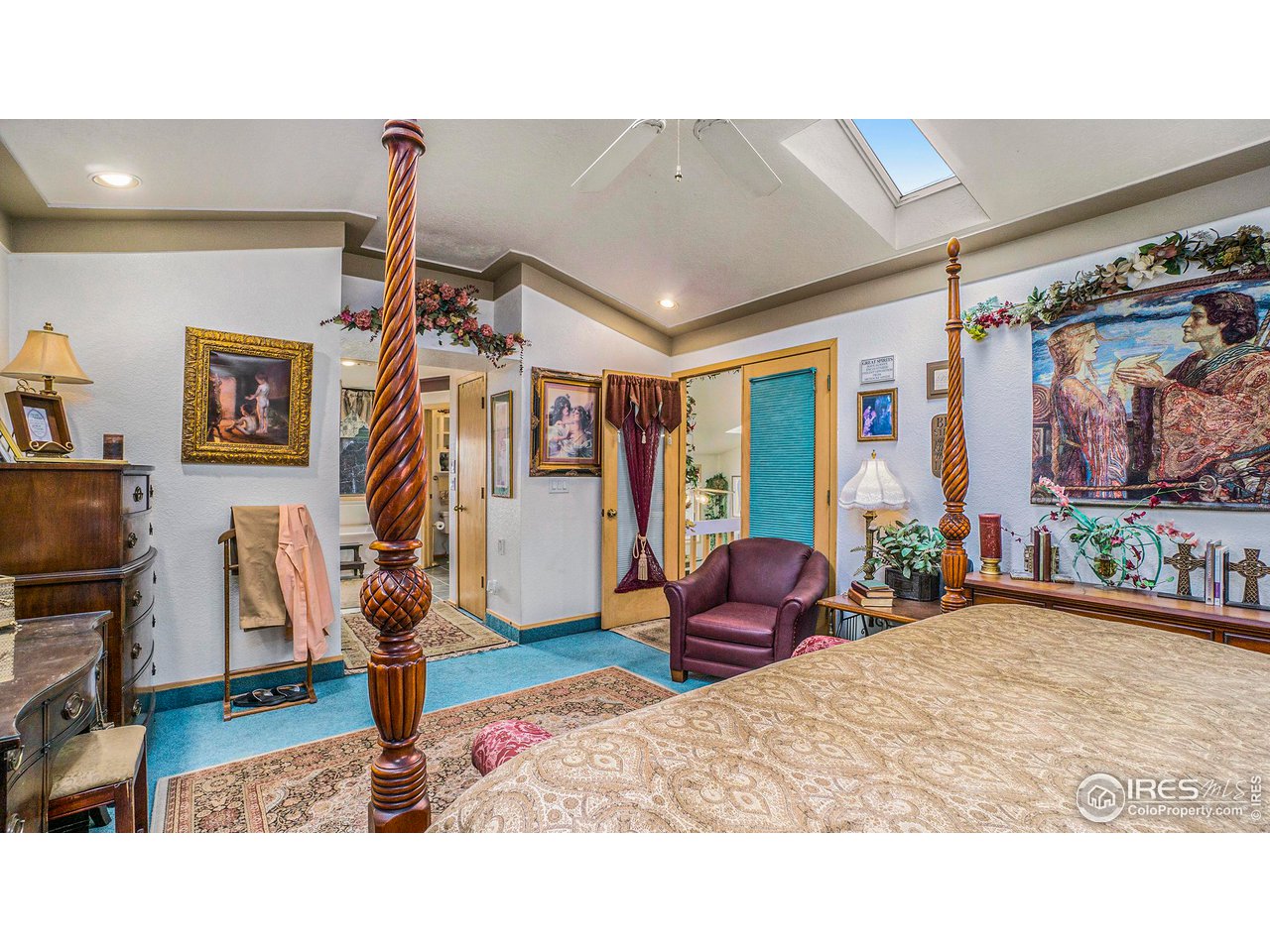 4328 West 14th Street Road Greeley, CO 80634 - Photo 15 of 30 a living room with furniture a flat screen tv and a floor to ceiling window
