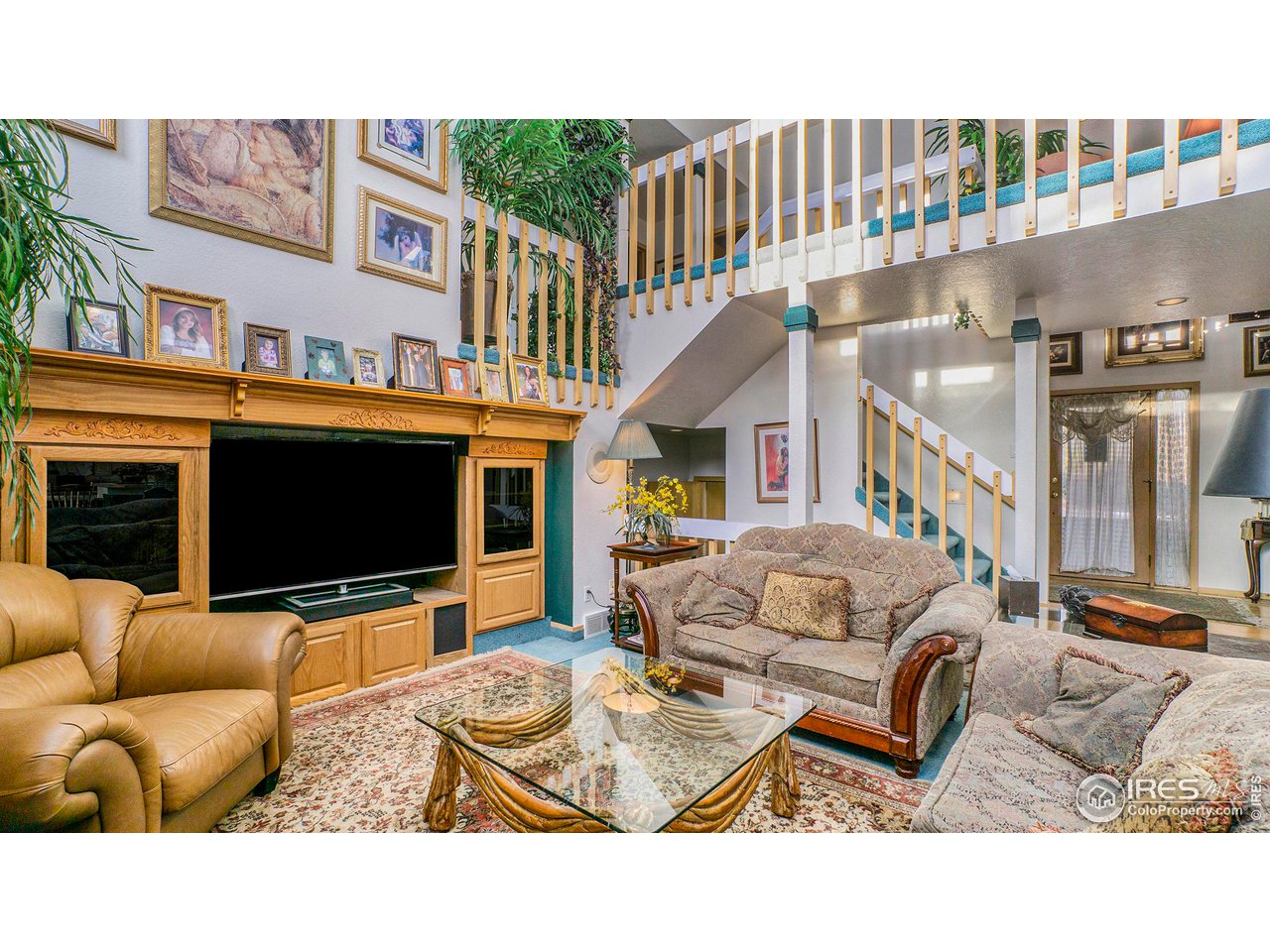 4328 West 14th Street Road Greeley, CO 80634 - Photo 5 of 30 a living room with furniture and a flat screen tv