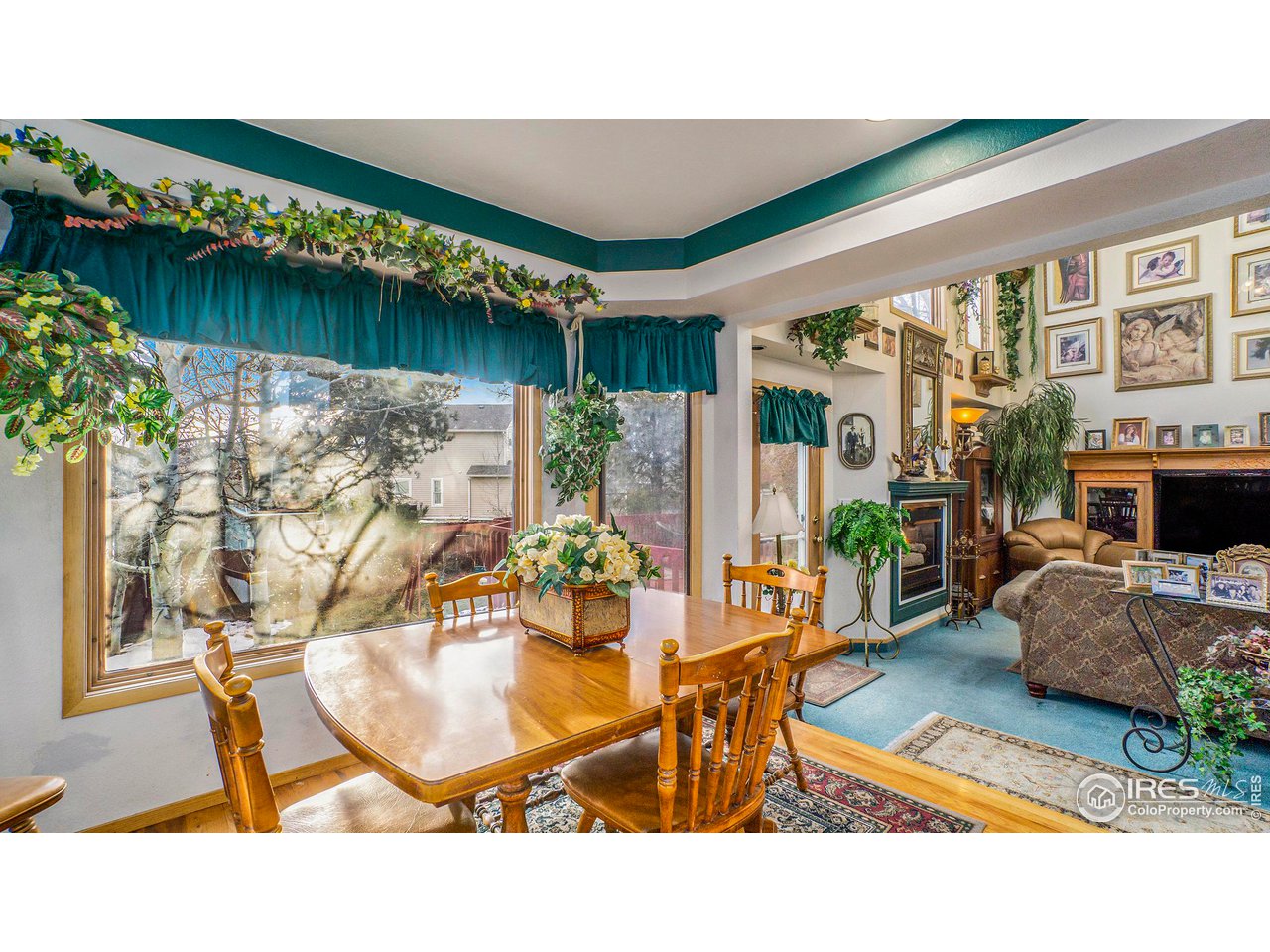 4328 West 14th Street Road Greeley, CO 80634 - Photo 7 of 30 a living room with furniture and a table