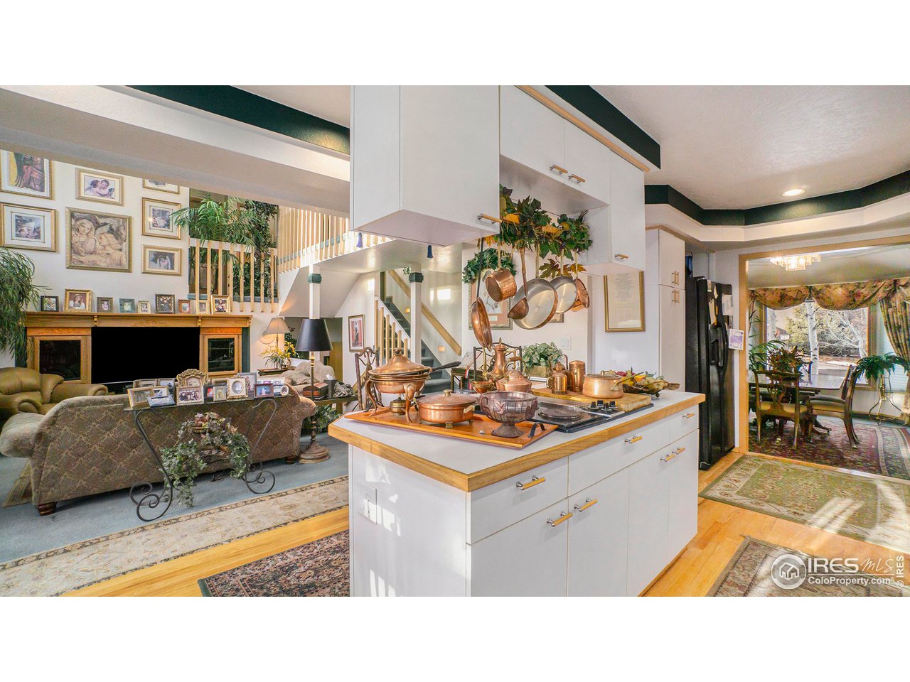4328 West 14th Street Road Greeley, CO 80634 - Photo 8 of 30 a living room with furniture and a large window