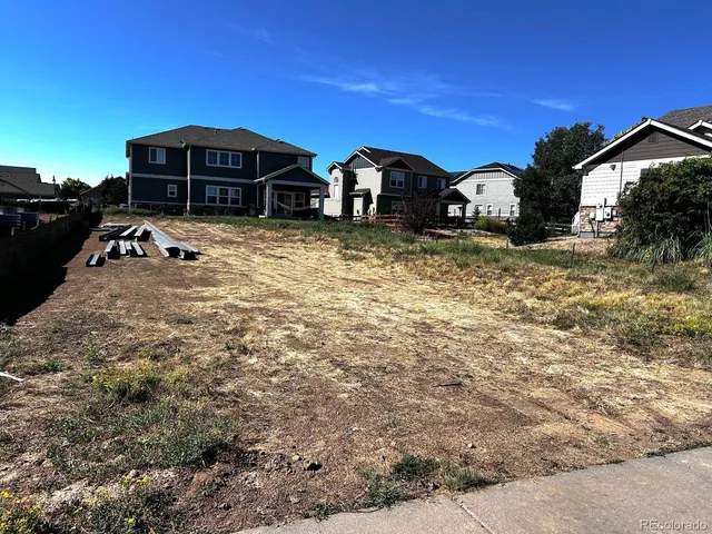 a view of a house with backyard space and porch