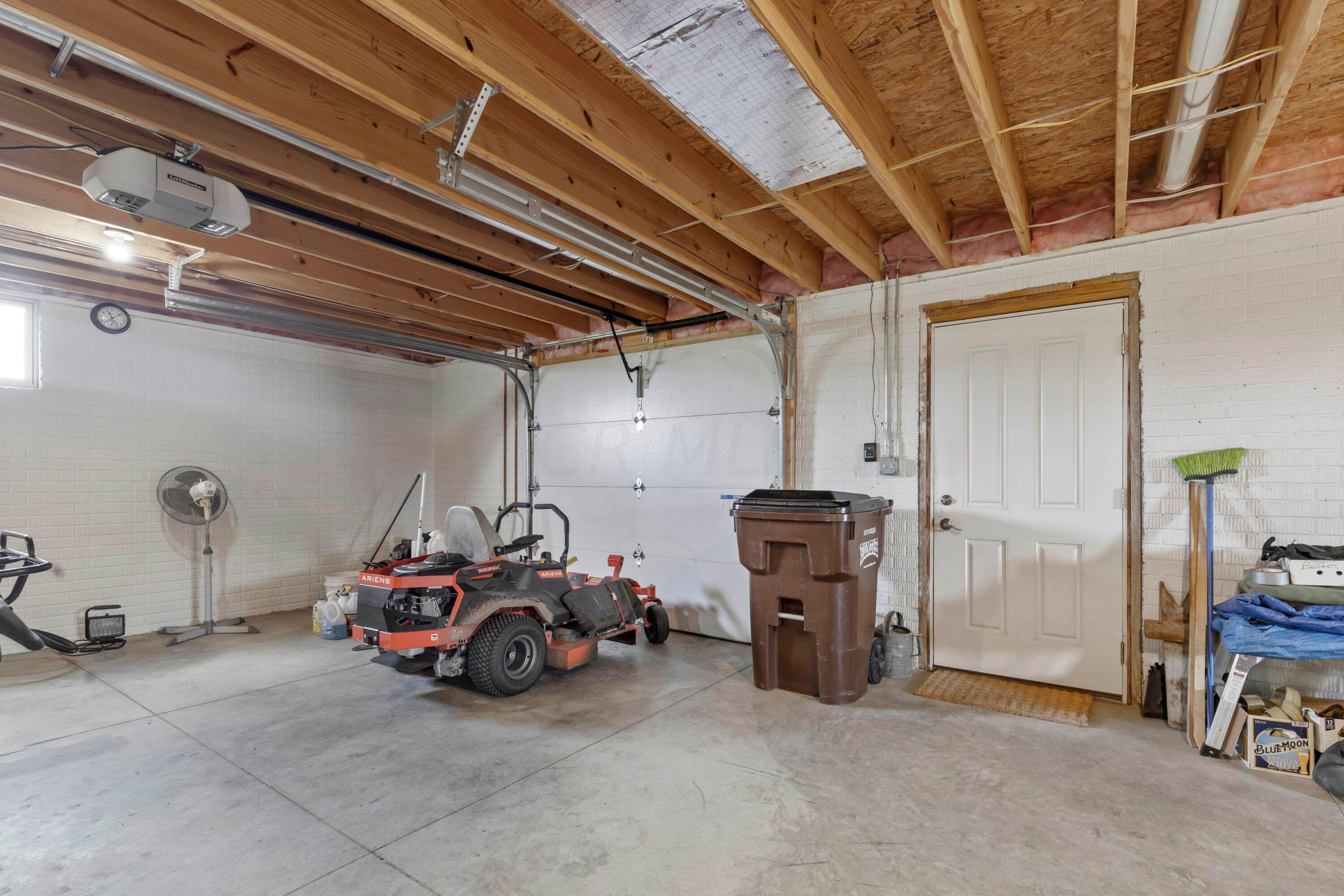 3644 Panhandle Road Delaware, OH 43015 - Photo 36 of 46 • Full basement
• Poured wall foundation
• Garage door
• Liftmaster® electric door opener
• Service door to Patio
• Comfortmaker® gas furnace
• A.O. Smith® water heater
• Walks out to rear drive/patio
• Safe does not remain