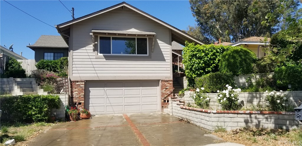 25129 Wheeler Road Newhall, CA 91321 - Photo 1 of 1 a front view of a house with a yard