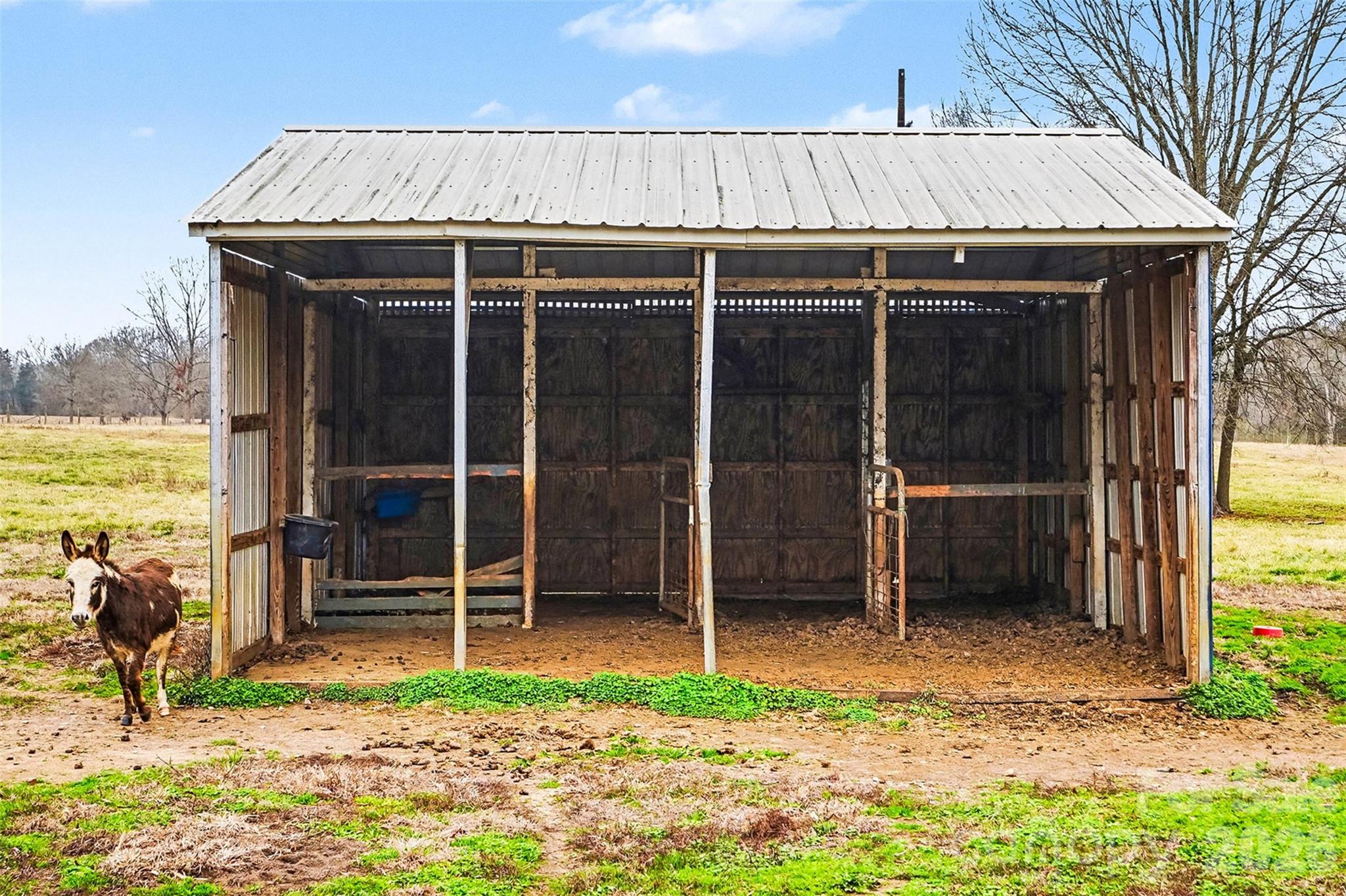 3135 Old Hickory Road Lancaster, SC 29720 - Photo 10 of 33 a backyard of a house with glass top table and chairs