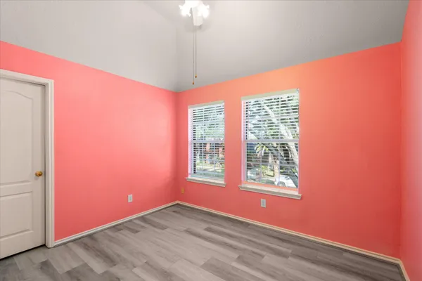 a view of an empty room with a window