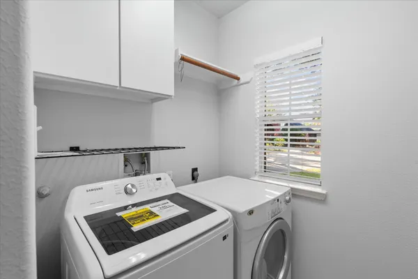 a utility room with dryer and washer