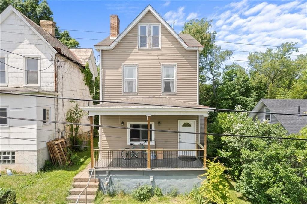 front view of a house with a yard