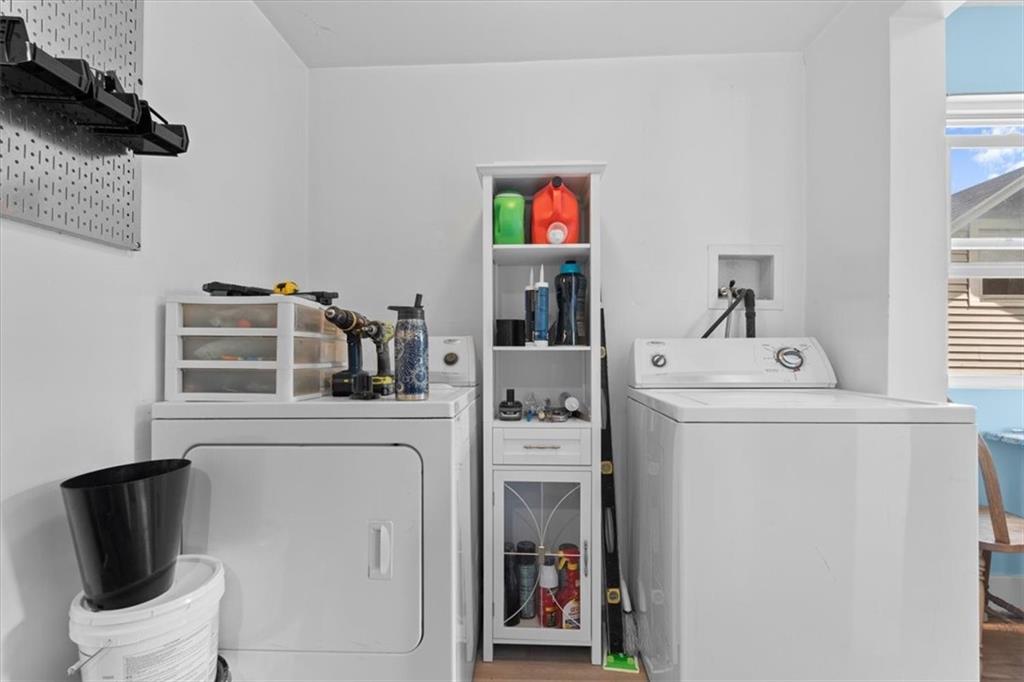 133 Owen Street McKees Rocks, PA 15136 - Photo 8 of 25 a utility room with dryer washer and a view of living room