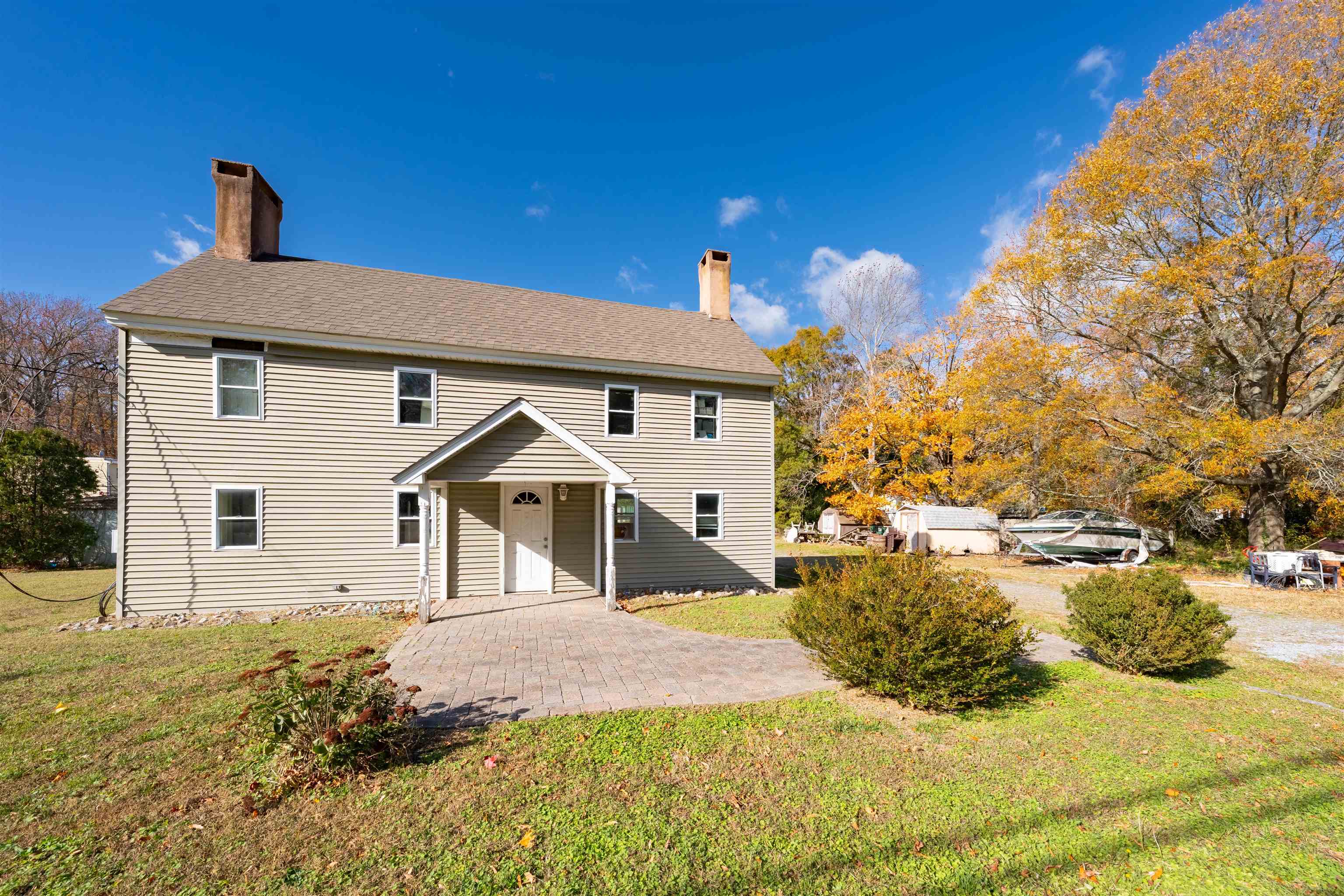 a front view of a house with a yard