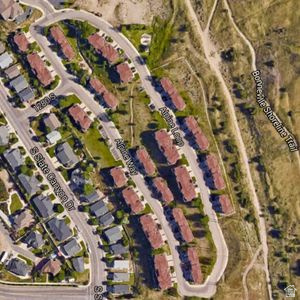 1251 Alpine Way Provo, UT 84606 - Photo 11 of 13 Aerial Map. Showing a residential development with individual structures and connecting roadways, bordered by a trail system