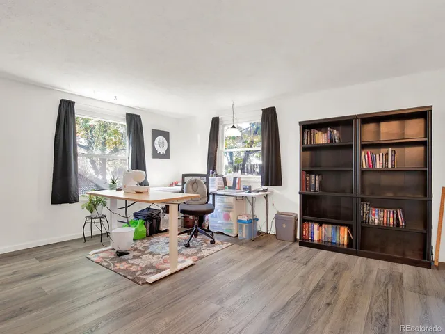 a view of a workspace with furniture and a workspace