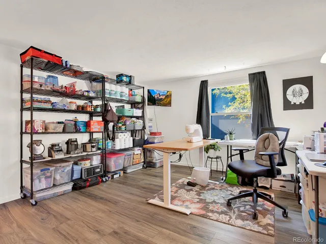 a workspace with furniture and a window