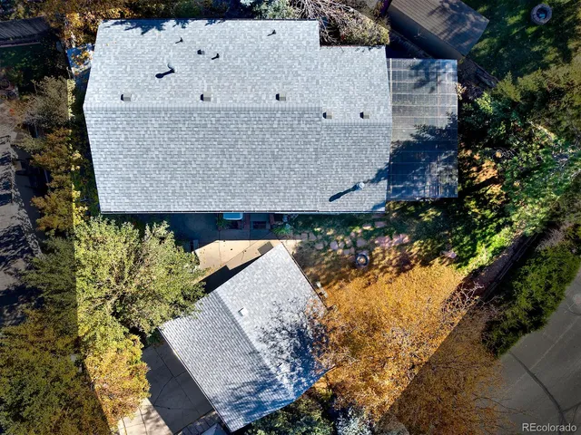 a view of residential houses with yard