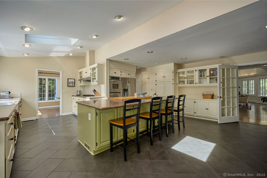 81 Norfield Road Weston, CT 06883 - Photo 11 of 40 a large dining space with furniture and window