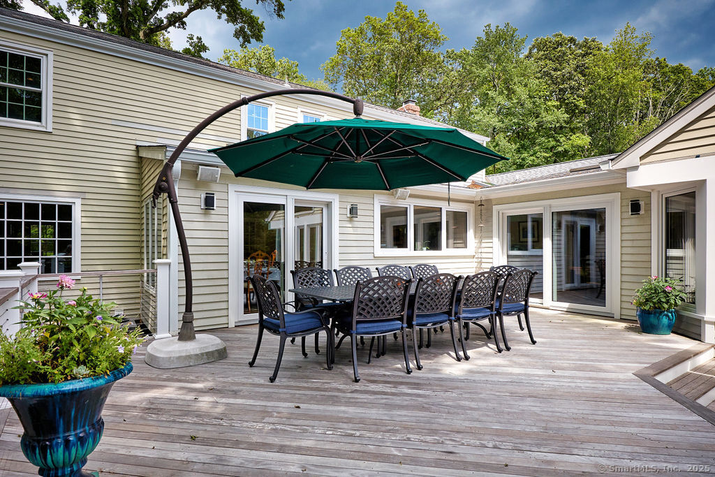81 Norfield Road Weston, CT 06883 - Photo 16 of 40 a patio with table and chairs