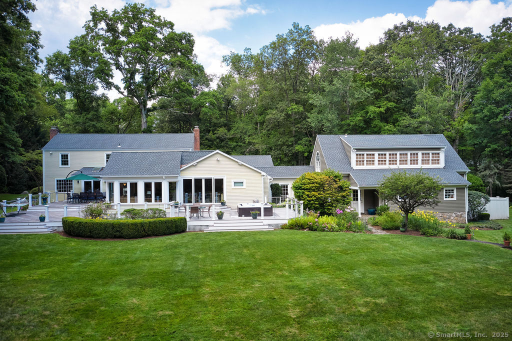 81 Norfield Road Weston, CT 06883 - Photo 18 of 40 a front view of a house with garden and trees