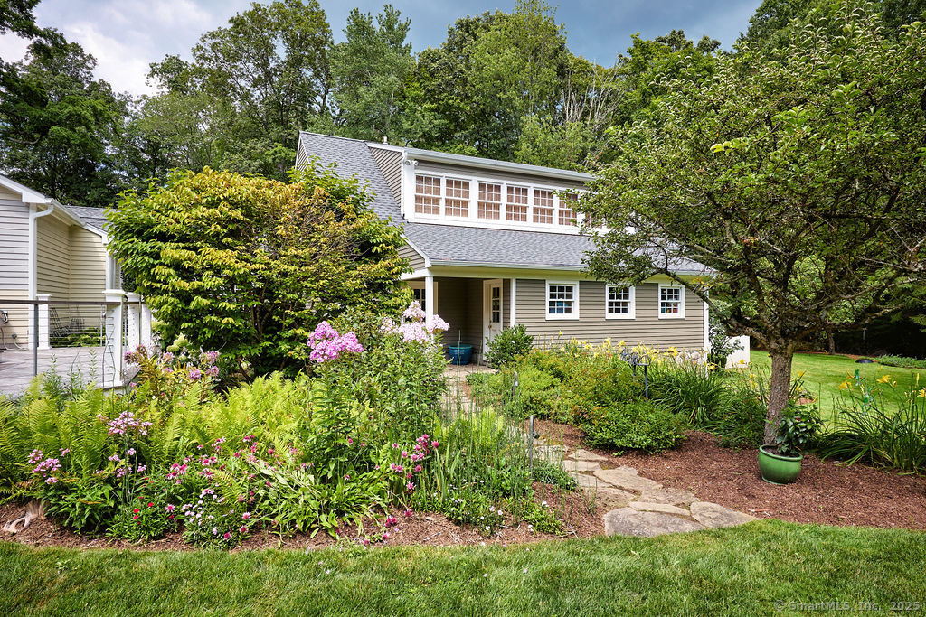 81 Norfield Road Weston, CT 06883 - Photo 19 of 40 a house view with a garden space