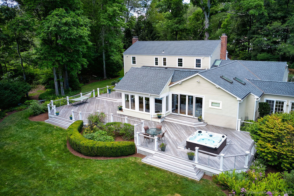 81 Norfield Road Weston, CT 06883 - Photo 2 of 40 a aerial view of a house with a yard table and chairs