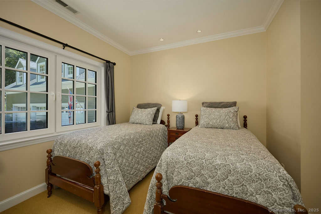 81 Norfield Road Weston, CT 06883 - Photo 24 of 40 a bedroom with two beds and windows