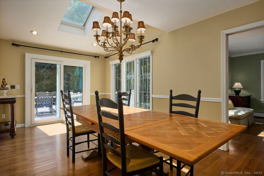 81 Norfield Road Weston, CT 06883 - Photo 29 of 40 a view of a dining room with furniture and wooden floor