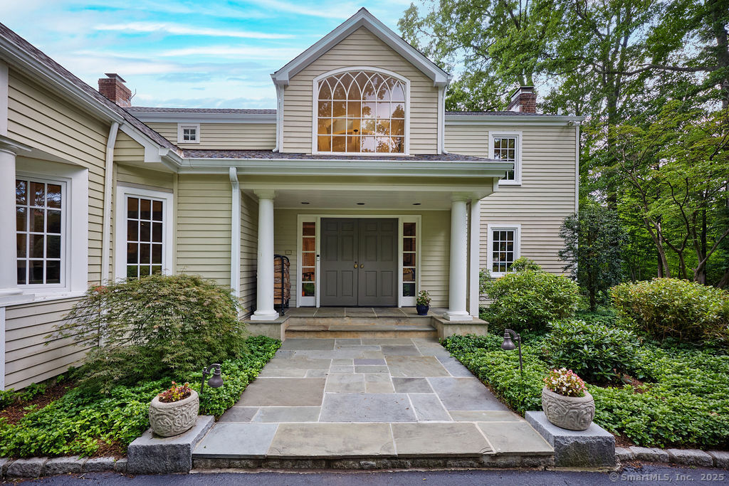 81 Norfield Road Weston, CT 06883 - Photo 3 of 40 front view of a house with a yard