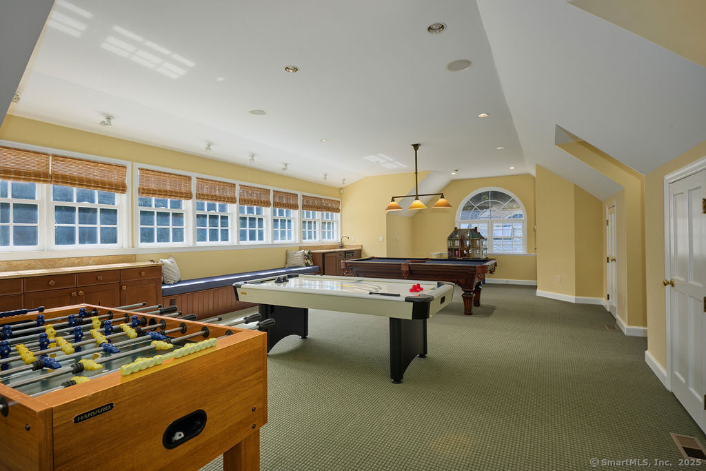 81 Norfield Road Weston, CT 06883 - Photo 31 of 40 a living room with furniture pool table and a window