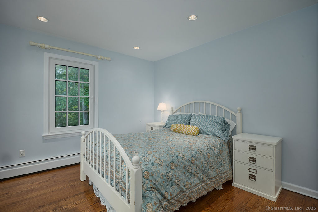 81 Norfield Road Weston, CT 06883 - Photo 34 of 40 a bedroom with a bed and a window