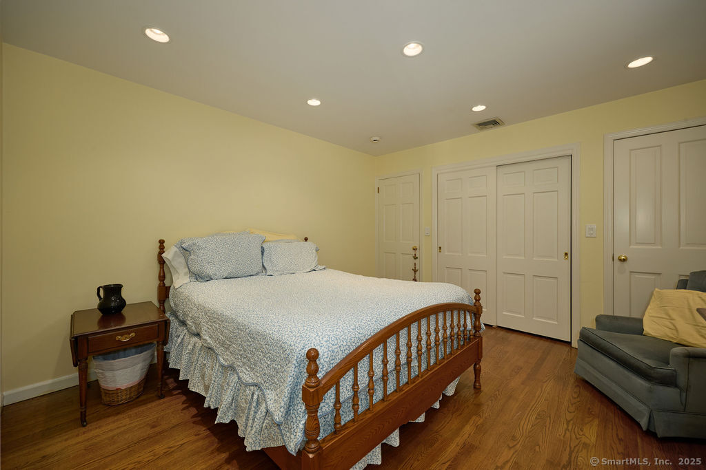 81 Norfield Road Weston, CT 06883 - Photo 36 of 40 a bedroom with a bed and a couch
