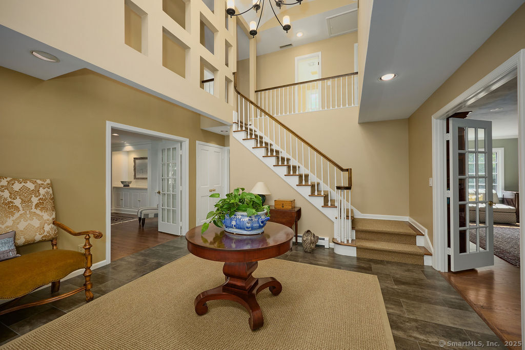 81 Norfield Road Weston, CT 06883 - Photo 4 of 40 a room with lots of furniture and wooden floor