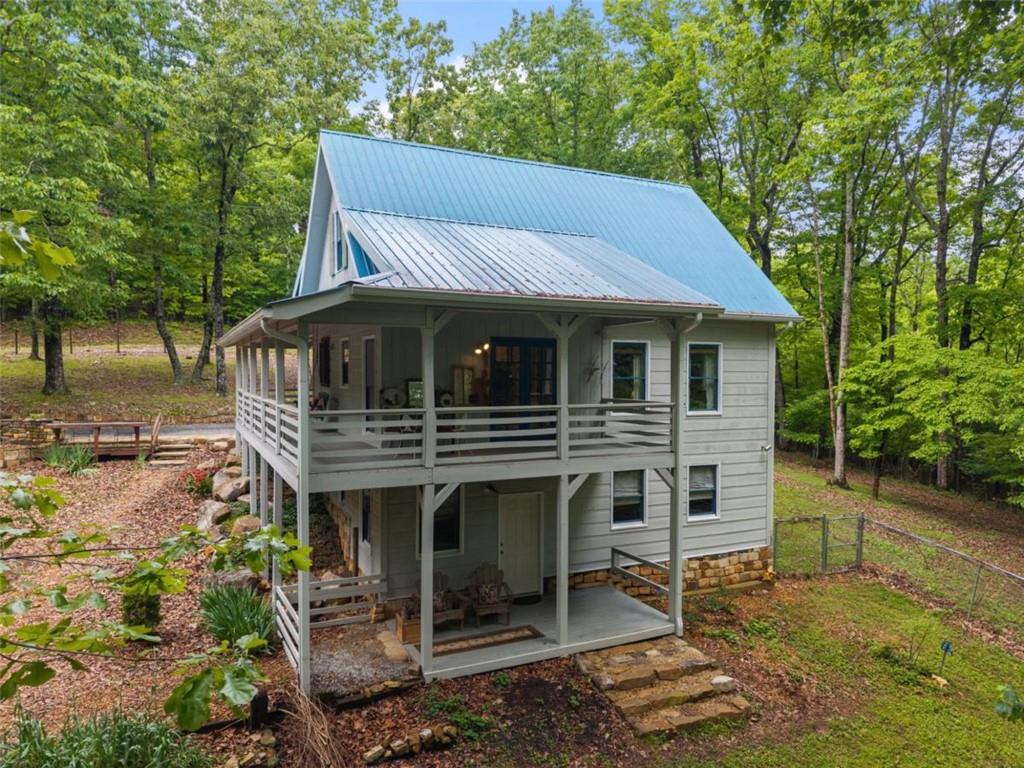 219 Raven Cliff Road Talking Rock, GA 30175 - Photo 76 of 77 a house view with a garden space