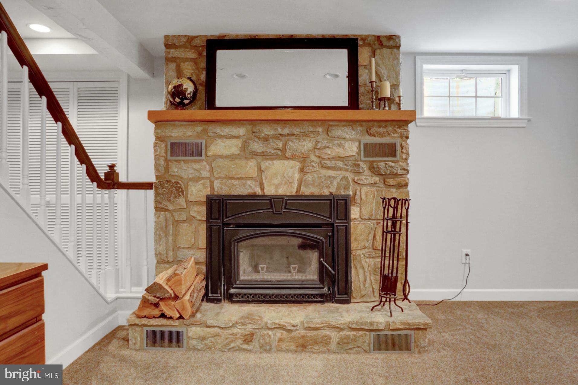 1454 Geigertown Road Birdsboro, PA 19508 - Photo 22 of 38 Stone fireplace with wood stove insert