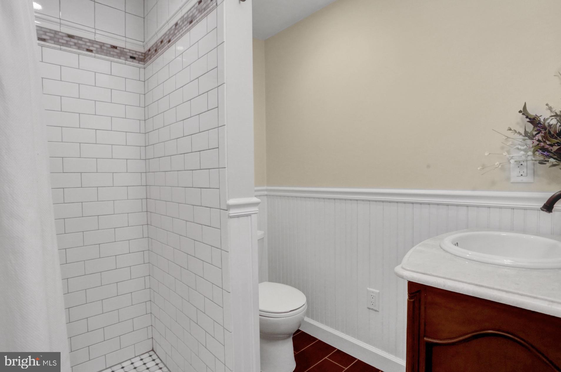 1454 Geigertown Road Birdsboro, PA 19508 - Photo 27 of 38 Subway tile shower in lower level bathroom