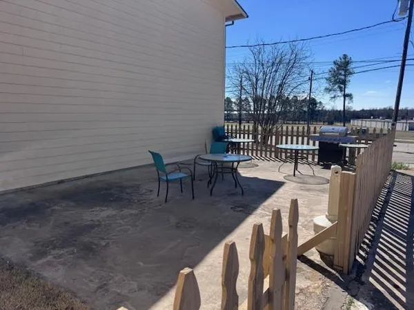 a view of a chairs and table on the deck