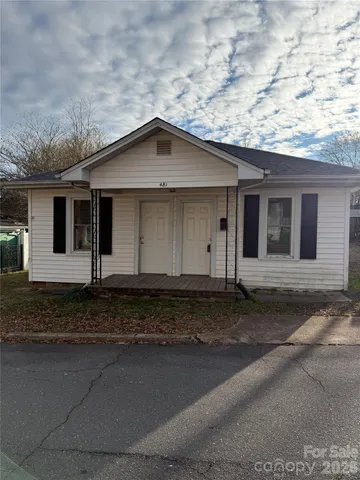 front view of a house with a big yard