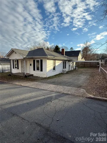 a front view of a house with yard