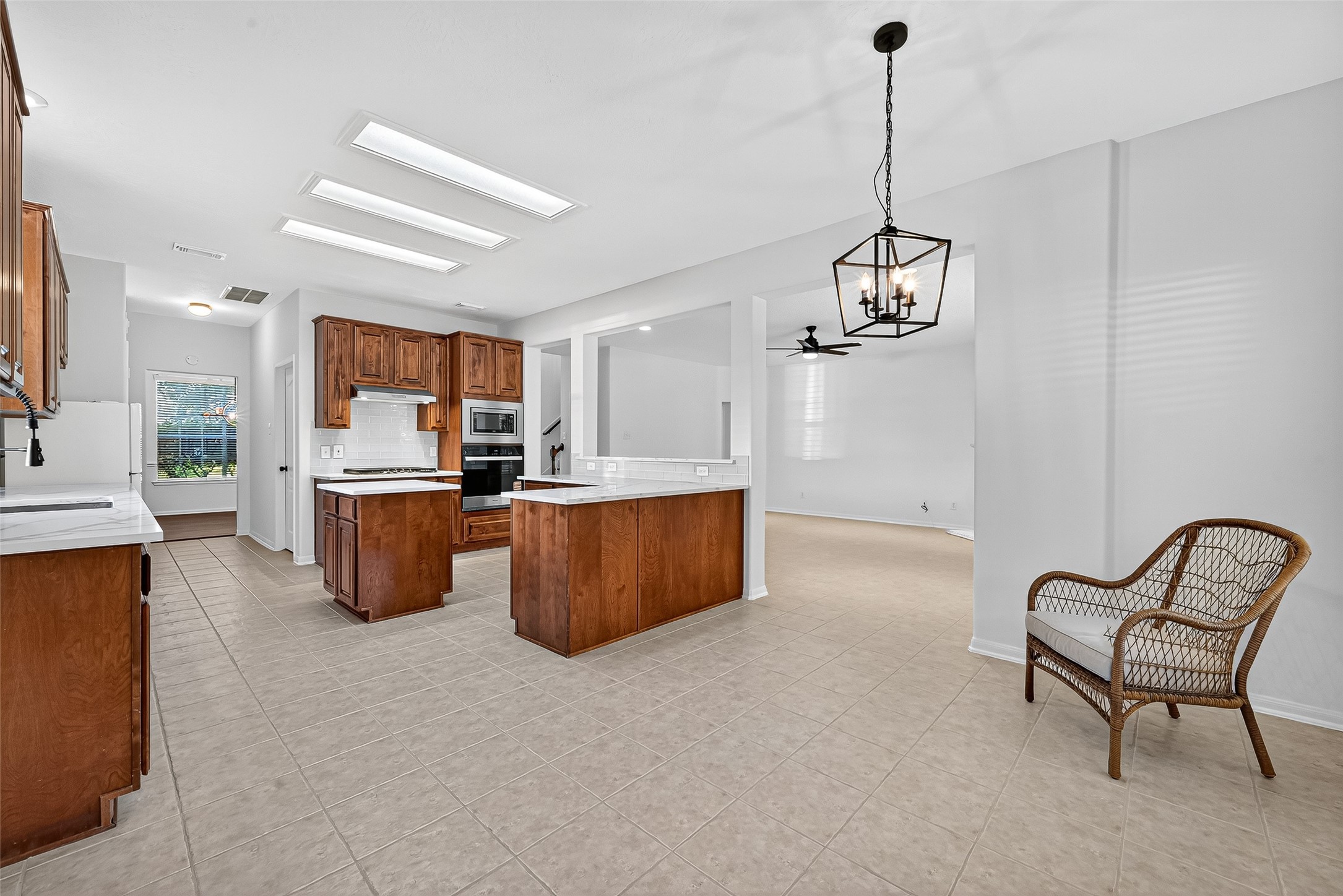 11727 Spring Path Court Tomball, TX 77377 - Photo 20 of 50 a view of kitchen with sink microwave and cabinets