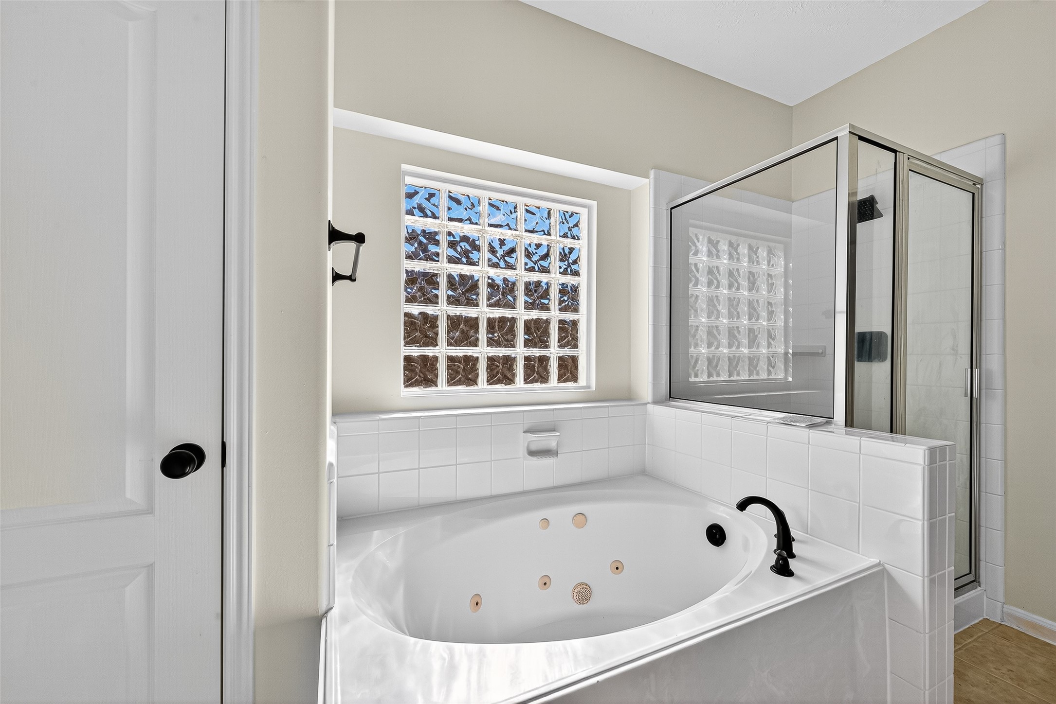 11727 Spring Path Court Tomball, TX 77377 - Photo 45 of 50 a bathroom with bathtub and window