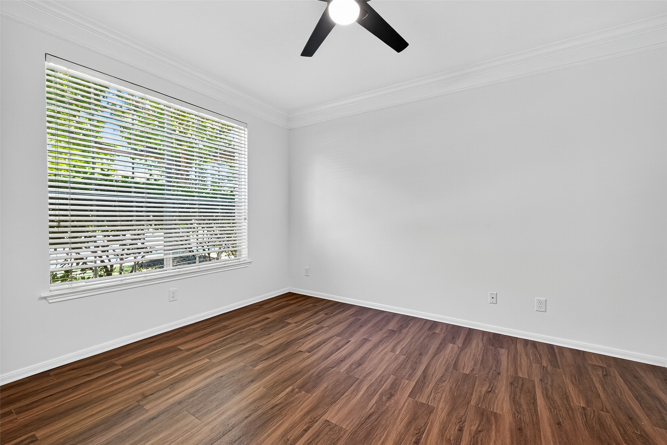 11727 Spring Path Court Tomball, TX 77377 - Photo 7 of 50 a view of an empty room with wooden floor and a window