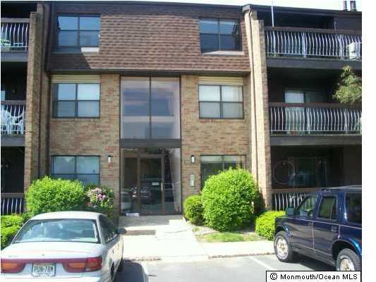 1422 Raspberry Court, Unit 22 Edison, NJ 08817 - Photo 1 of 2 a view of house with outdoor space and glass windows