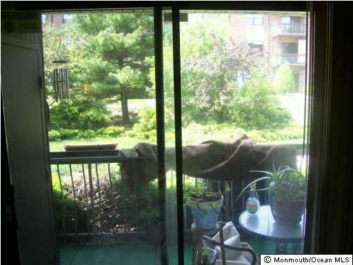 1422 Raspberry Court, Unit 22 Edison, NJ 08817 - Photo 2 of 2 a view of a lake from a window