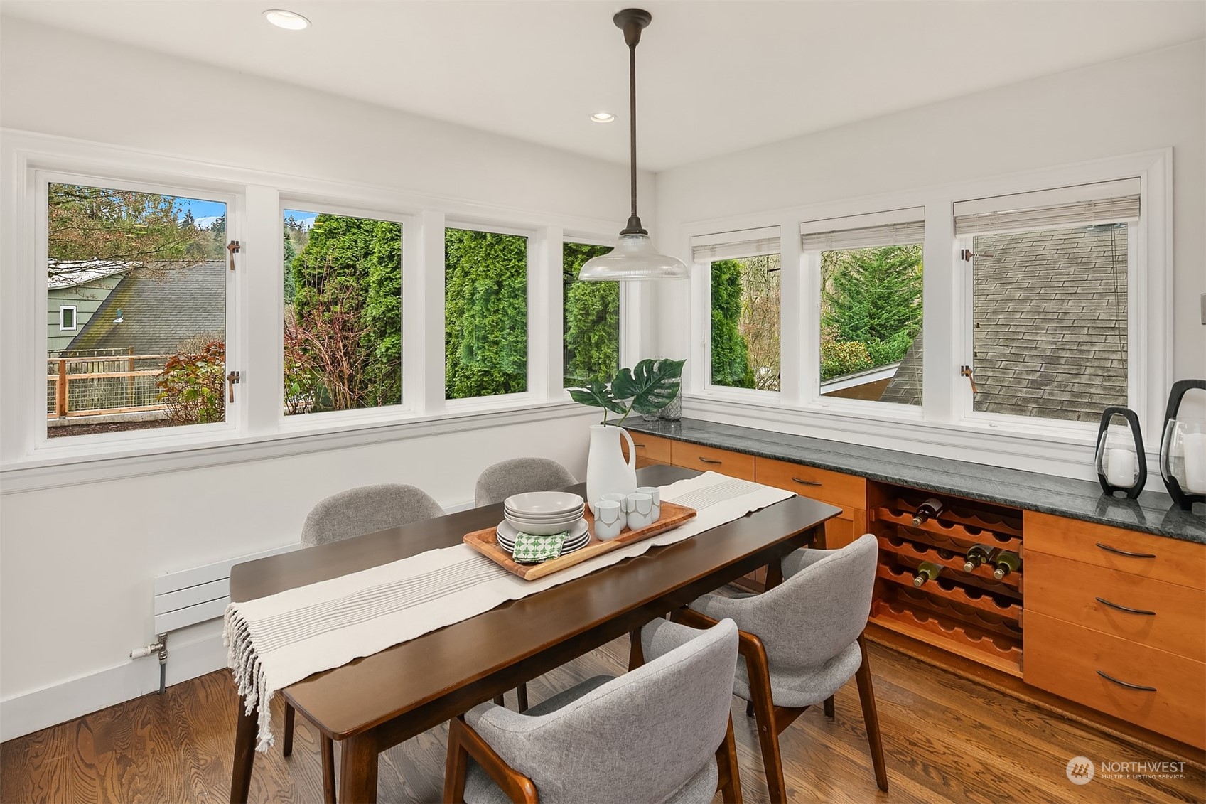 1925 East Lynn Street Seattle, WA 98112 - Photo 12 of 36 a dining room with furniture a chandelier and wooden floor