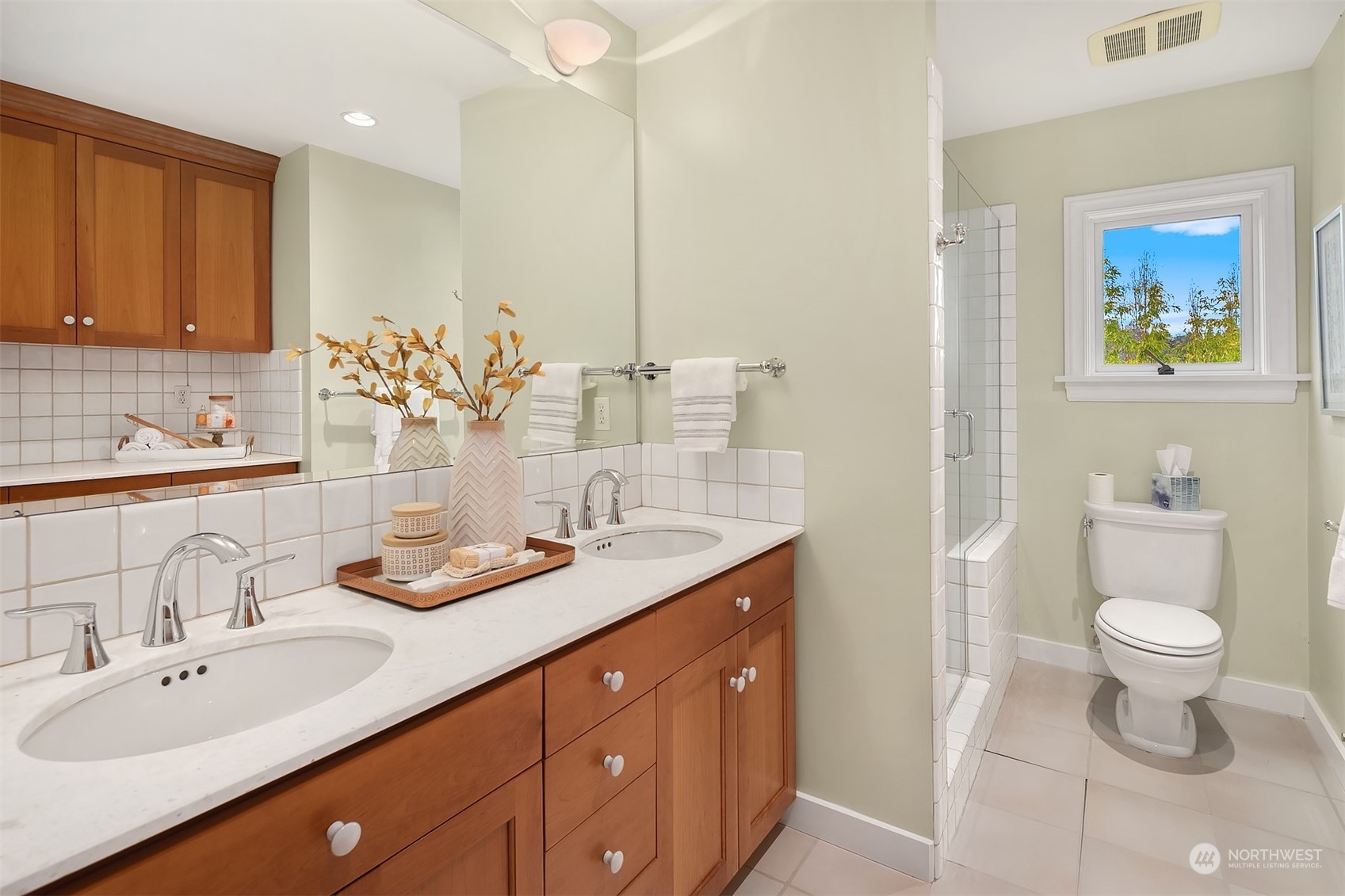 1925 East Lynn Street Seattle, WA 98112 - Photo 19 of 36 a bathroom with a toilet a sink and a mirror