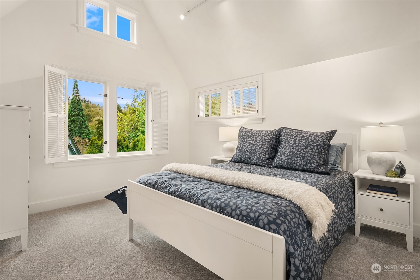 1925 East Lynn Street Seattle, WA 98112 - Photo 20 of 36 a bedroom with a large bed and a window