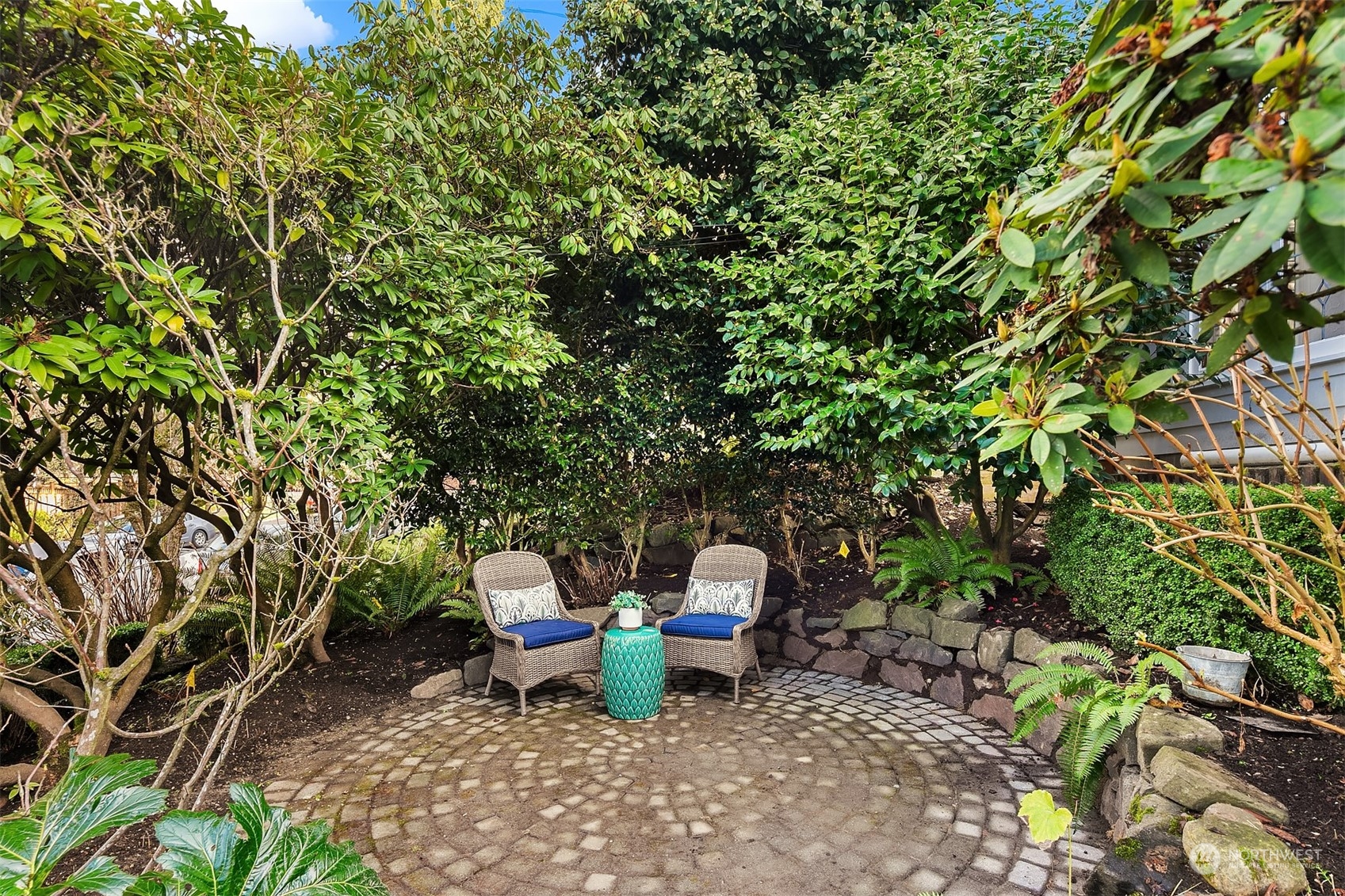 1925 East Lynn Street Seattle, WA 98112 - Photo 2 of 36 a view of a backyard with plants and a tree