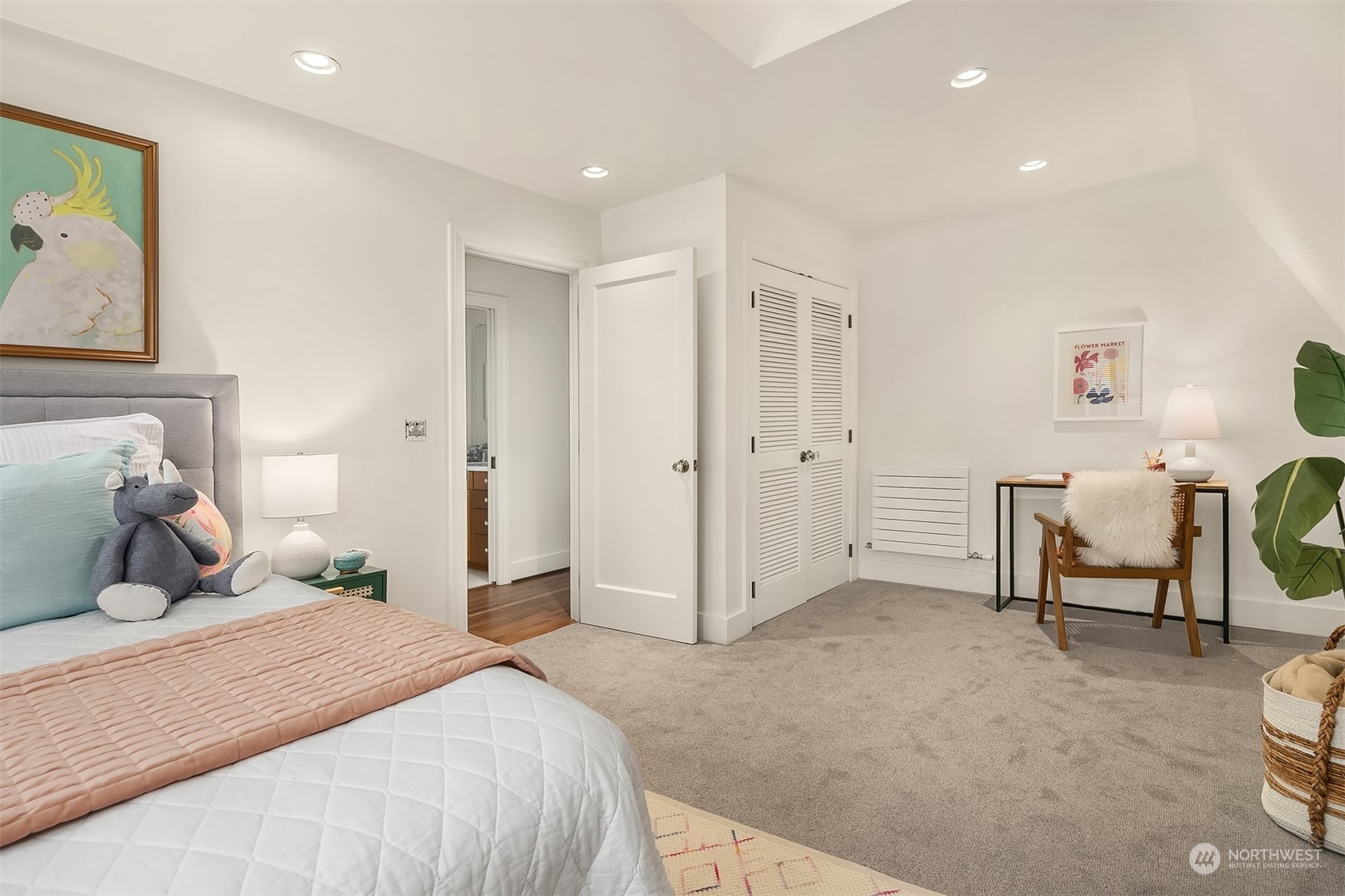 1925 East Lynn Street Seattle, WA 98112 - Photo 22 of 36 a bedroom with a bed and a chandelier